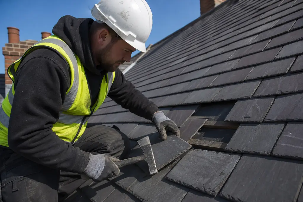 Roof repair work in progress on a Guernsey home